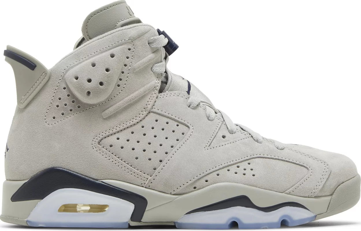 a picture of the Air Jordan 6 featuring suede and grey and blue color tones.